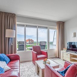 Bright living space of Apartment Juliana 138 in De Koog, Texel, with sea view.