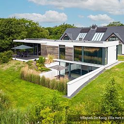 Luxury family villa with pool in De Koog, Texel. Beautiful garden and modern architecture on the Wadden Islands.