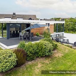 Luxury family villa with swimming pool in De Koog, Texel. Cozy terrace for family activities on the Wadden Islands.