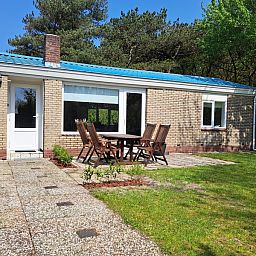 Vacation home Hoog Koog 10 in Bungalowpark Hoog Koog, De Koog, Texel with spacious outdoor area and seating.