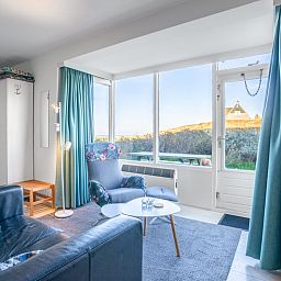 Bright interior space of Apartment Juliana 068 Island and Sea View, De Koog, Texel with comfortable seating.