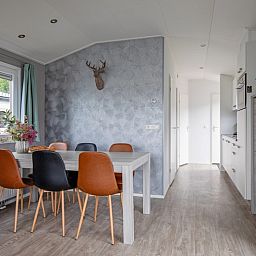 Stylish dining room in Chalet Bregkoog 12, De Koog, Texel on the Wadden Islands, with an inviting dining table.