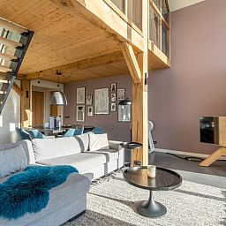 Modern living room with high ceilings in Holiday home in De Koog Texel, perfect for a luxurious stay on the Wadden Islands.