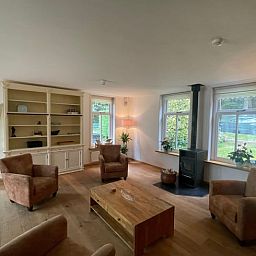 Bright and spacious living room in Cottage in Den Burg, Texel, perfect for relaxation.