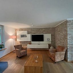 Modern living room with flat screen in Cottage in Den Burg, Texel, ideal for family gatherings.