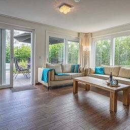 Bright living room of Villa 3C in Den Burg, Texel, overlooking the garden, comfortable vacation home on the Wadden Islands.