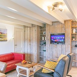 Cozy living room of Apartment Hof, Den Hoorn, Texel, with comfortable seating area.