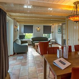 Cozy living room in Holiday home in Oosterend, Texel, with comfortable seating.