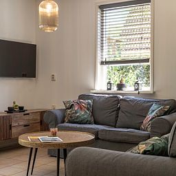 Comfortable living room in Type I - No. 55 Marel, vacation home in Oosterend Texel, with modern furnishings for a relaxing stay on the Wadden Islands.