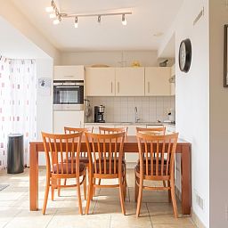 Kitchen and dining area in Type III - No. 21B Pheasant, Oosterend, Texel with modern amenities.