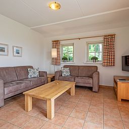Cozy sitting area in 't Mienthuis - De Jonker, vacation home on Texel, De Dennen, ideal for a relaxing stay on the Wadden Islands.