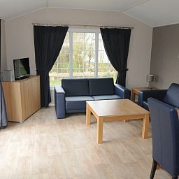 Gemuetliches Wohnzimmer des Villetta Ferienhauses fuer 4 Personen in De Dennen, Texel, Watteninseln.