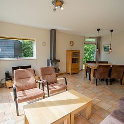 Spacious living space in Bungalow Uterste Coogh 98, De Dennen, Texel with modern furnishings.