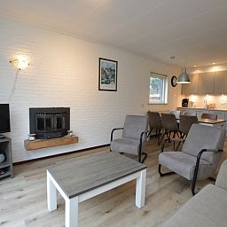 Modern decor in Holiday home de Parel 196, De Dennen, Texel with fireplace.