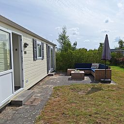Entrance to vacation home with terrace at Vakantiepark de Bremakker, Texel.