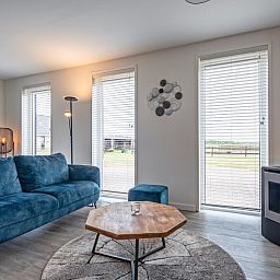 Gemuetliche Sitzecke in Wulpenweid 10 de Wulp, Ferienhaus De Dennen Texel mit Blick auf den Garten.