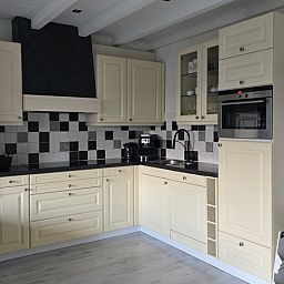 Modern kitchen in Helianthus vacation home, De Dennen, Texel with luxury appliances.