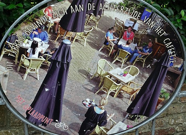 Cozy living room in vacation home 419, De Cocksdorp, Texel with open kitchen.