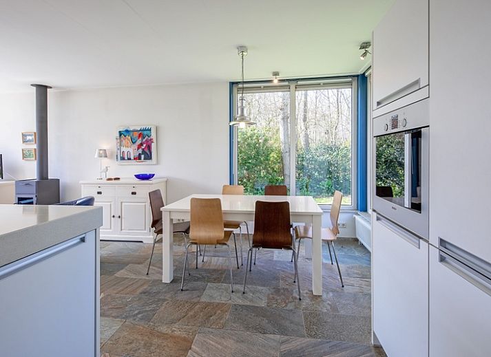 Vacation home Slufterhoek 034 in De Cocksdorp on Texel, spacious garden and terrace for relaxing stay.