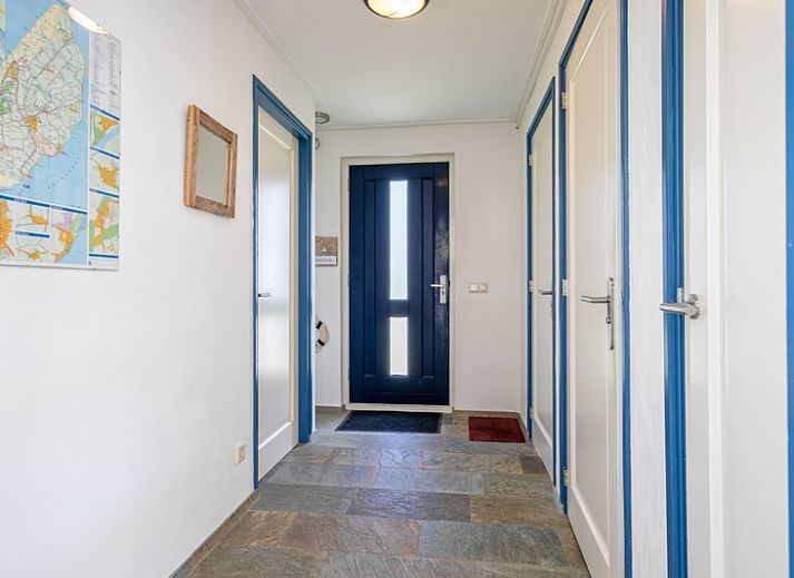 Cozy living room of Holiday home Slufterhoek 034, Texel, with modern furnishings and lots of light.