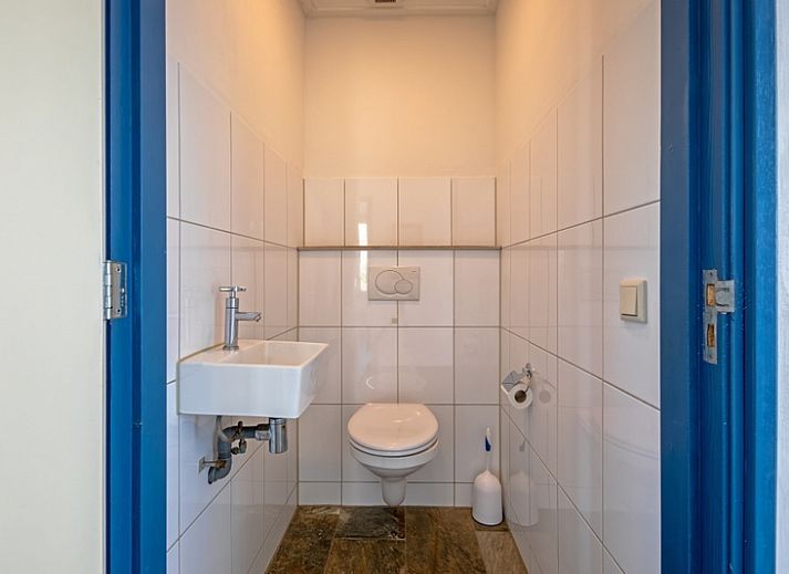 Comfortable sitting area in Holiday home Slufterhoek 034, De Cocksdorp, ideal for relaxing moments.