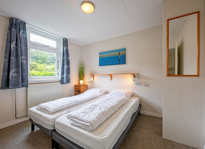 Gemuetliches Wohnzimmer des Ferienhauses Slufterhoek 150 in De Cocksdorp Texel mit bequemen Sitzgelegenheiten.