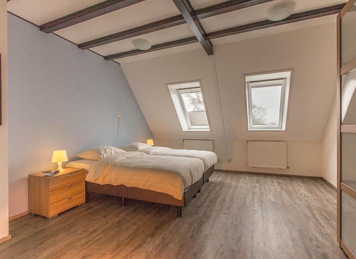 Gemuetliches Wohnzimmer im Typ X-7 Ferienhaus De Cocksdorp Texel mit bequemen Sofas