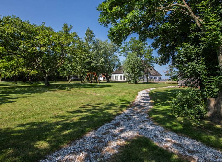 Gemuetliches Wohnzimmer im Typ X-7 Ferienhaus De Cocksdorp Texel mit bequemen Sofas