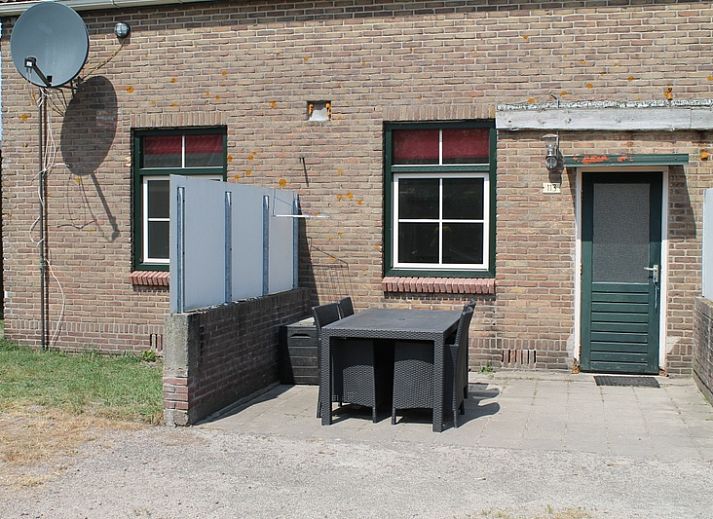 Under the lighthouse 113 vacation home in De Cocksdorp Texel with rustic garden and terrace for relaxing stay.