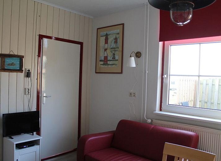 Under the lighthouse 113 vacation home in De Cocksdorp Texel with rustic garden and terrace for relaxing stay.