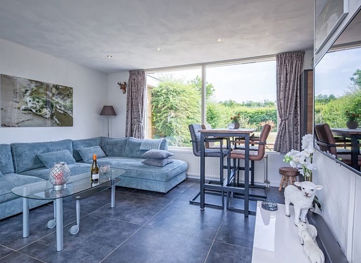 Veranda with comfortable sofas at Bungalowpark Tamarisk - Bungalow Duin aan Zee Texel in De Cocksdorp, Wadden Islands.