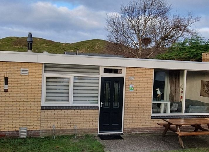 Terrace of Bungalow Duin aan Zee Texel at Bungalowpark Tamarisk, located in the serene surroundings of De Cocksdorp.