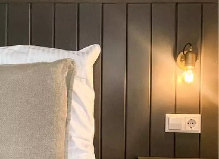 Gemuetliches Wohnzimmer im Ferienhaus Hogezandskil, De Cocksdorp, Texel mit bequemer Sitzecke und viel Licht.