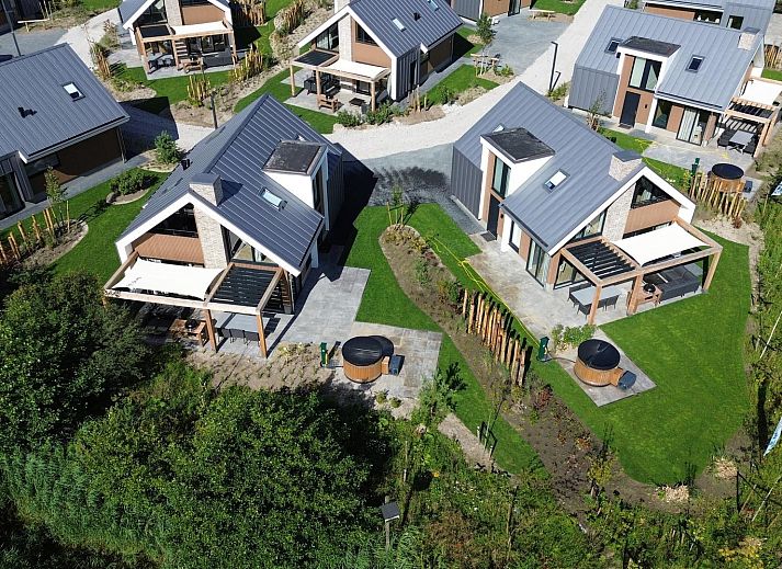 Aerial view of Duinvilla Wellness 5 in De Cocksdorp, Texel. Luxury vacation home with veranda and green garden on the Wadden Islands.