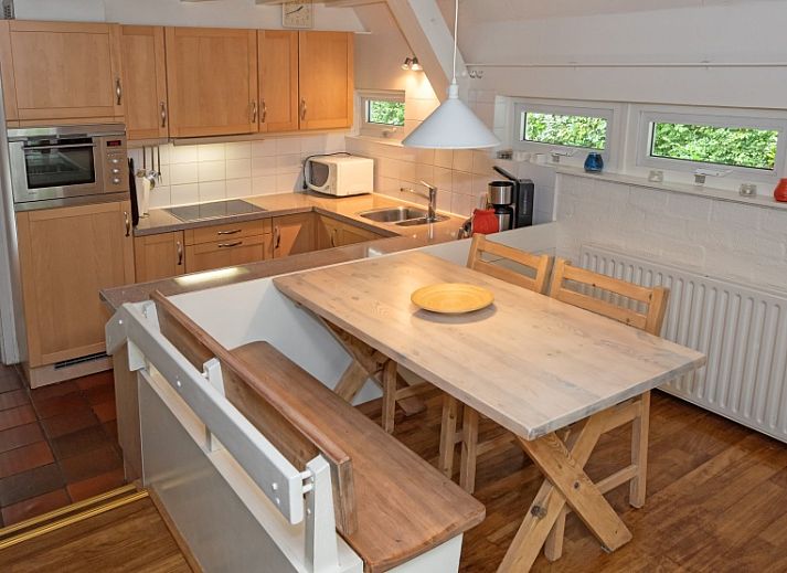 Cozy living room of Holiday home Slufterduin 108 in De Cocksdorp Texel, perfect for relaxation on the Wadden Islands.