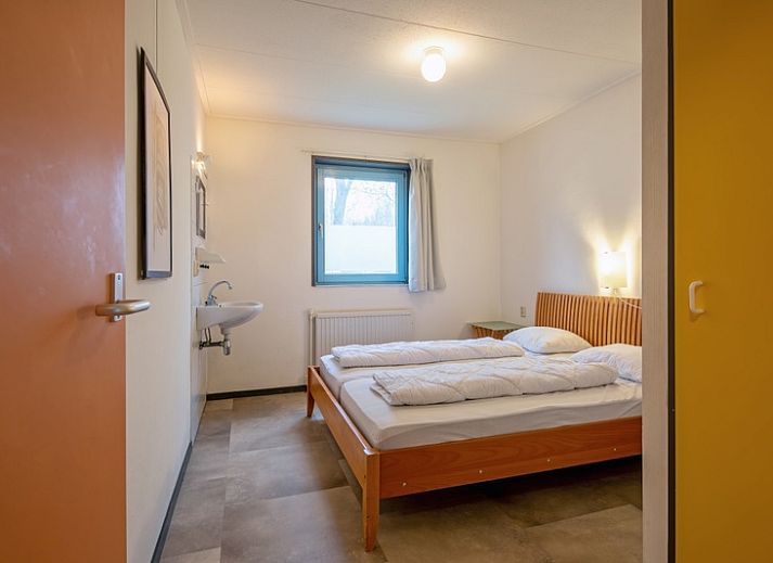 Comfortable living room with wood stove in Holiday home Slufterhoek 118, De Cocksdorp, Texel.