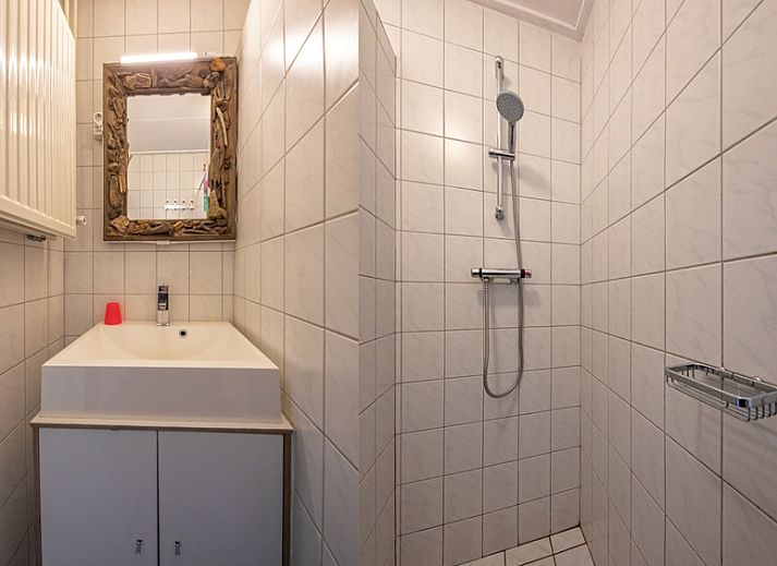 Comfortable living room with wood stove in Holiday home Slufterhoek 118, De Cocksdorp, Texel.