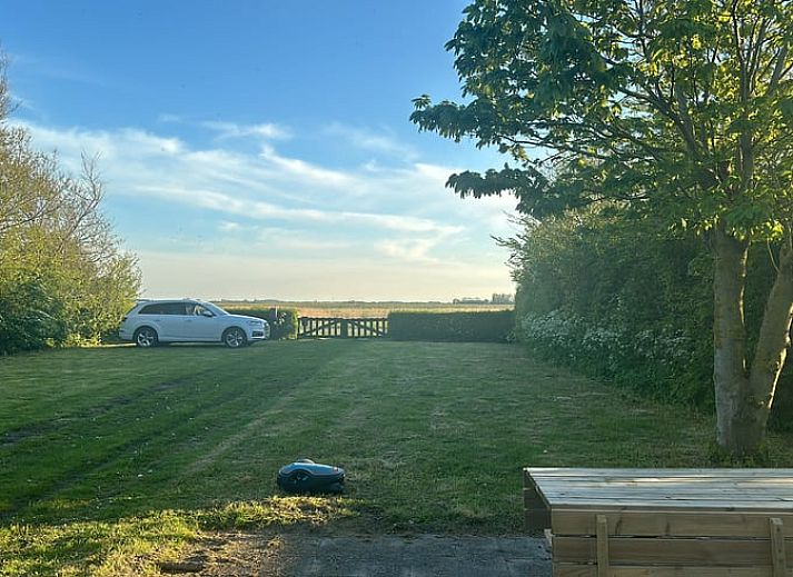Spacious lawn at Holiday home in De Cocksdorp, Texel, Wadden Islands, perfect for outdoor activities.