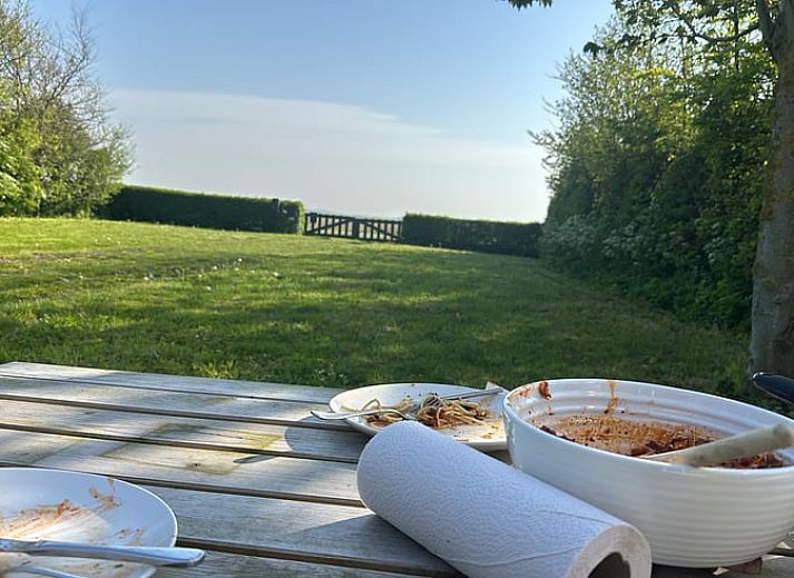 Spacious lawn at Holiday home in De Cocksdorp, Texel, Wadden Islands, perfect for outdoor activities.