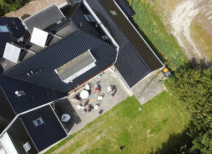 Outdoor dining overlooking the garden at Holiday home in De Cocksdorp, Texel, Wadden Islands.