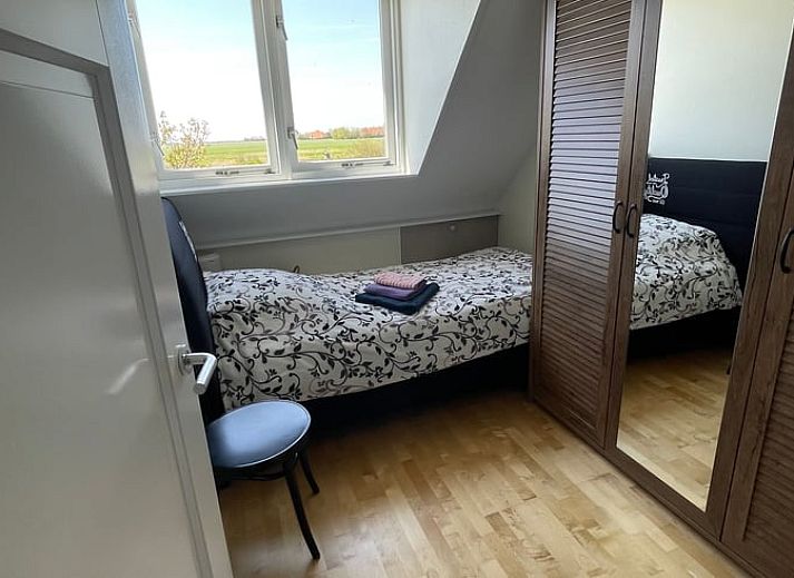 Outdoor dining overlooking the garden at Holiday home in De Cocksdorp, Texel, Wadden Islands.