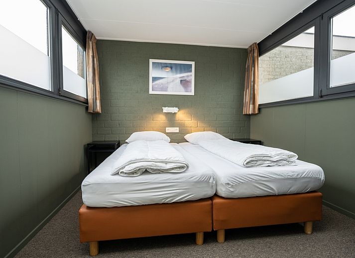 Vakantiehuis 34A in De Cocksdorp Texel met zonnig terras en groene omgeving.