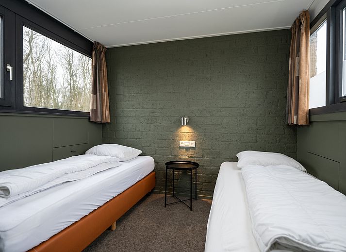 Gezellige woonkamer van Vakantiehuis 34A in De Cocksdorp Texel met moderne inrichting.