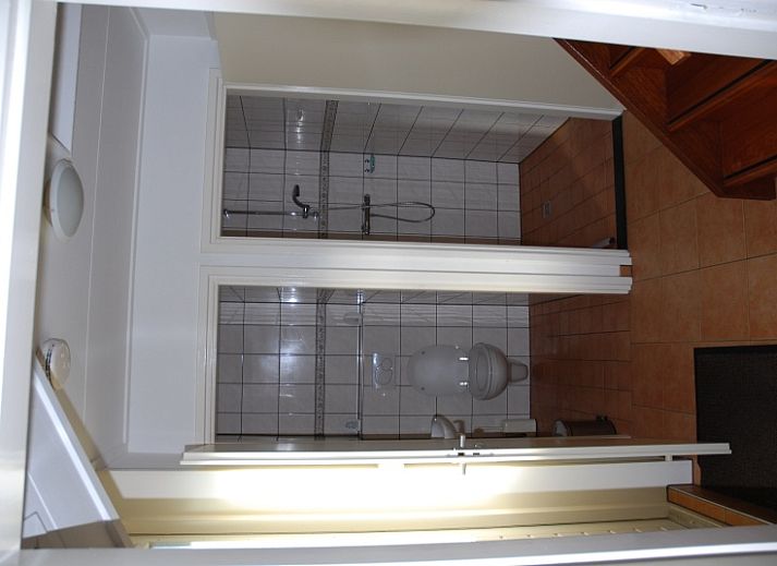 Cozy kitchen in Kikkertstraat 067, De Cocksdorp, Texel, complete with modern appliances.