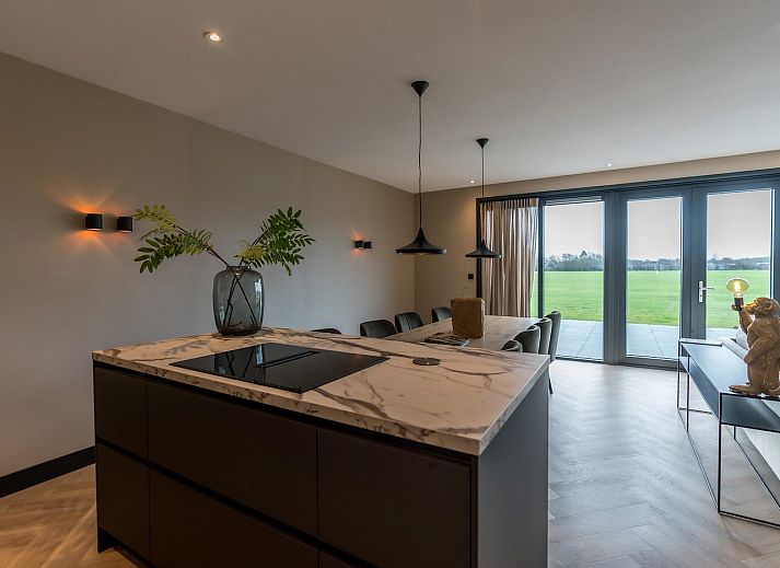 Luxury living room of Princenhof 3 - 8-bed vacation home in De Cocksdorp, Texel overlooking the countryside.