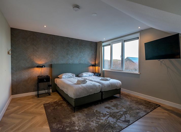 Stylish sitting area in Princenhof 3 - 8-pers vacation home, De Cocksdorp, Texel with comfortable sofas.