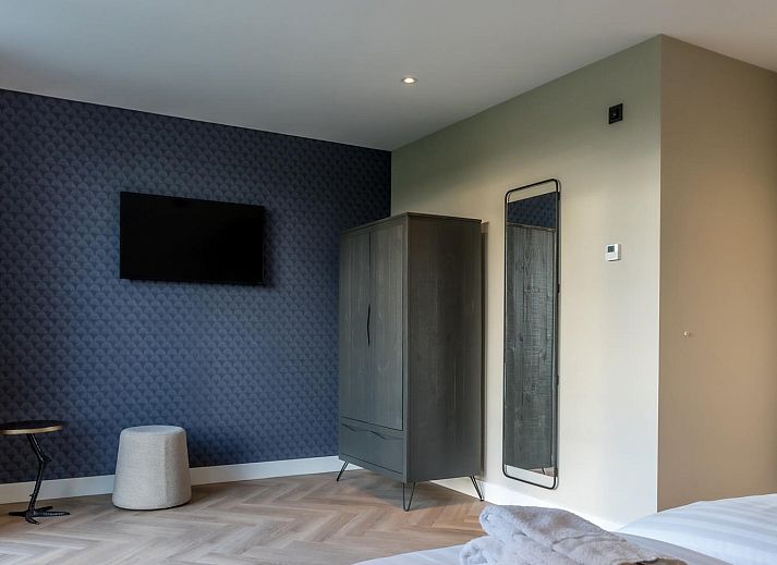 Stylish sitting area in Princenhof 3 - 8-pers vacation home, De Cocksdorp, Texel with comfortable sofas.