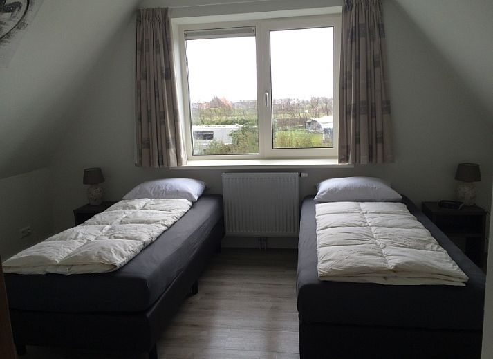 Gemuetliches Wohnzimmer im Bungalow Zevenbergen, De Cocksdorp, Texel, mit grosser Sitzecke.