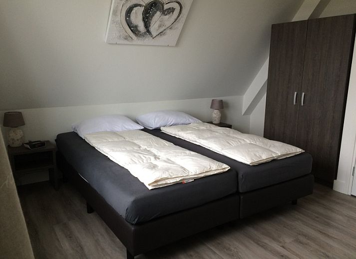 Gemuetliches Wohnzimmer im Bungalow Zevenbergen, De Cocksdorp, Texel, mit grosser Sitzecke.