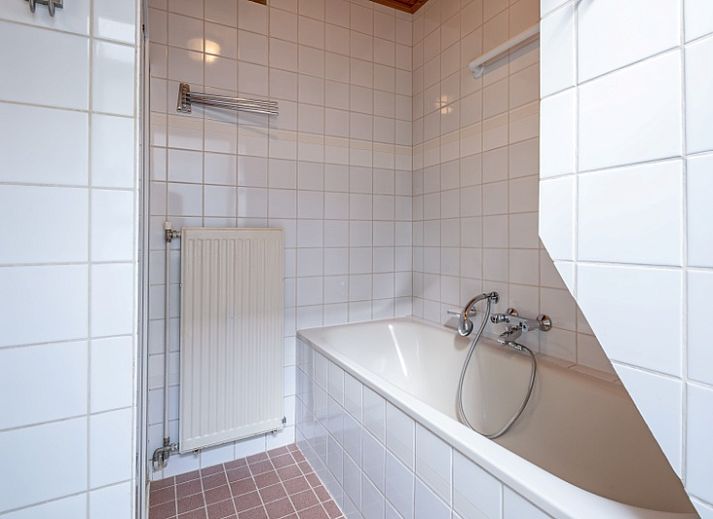 Gezellige woonkamer in Vakantiehuis Slufterduin 52a, De Cocksdorp, Texel met comfortabele zithoek.